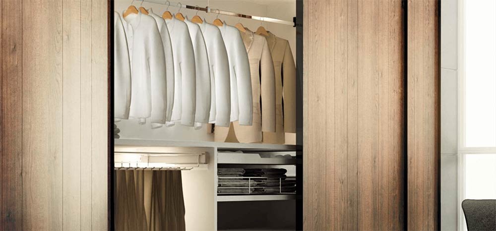 LOOX Lighting Hafele (small) A wardrobe filled with Tan coloured outfits illuminated with Hafele LOOX Lighting